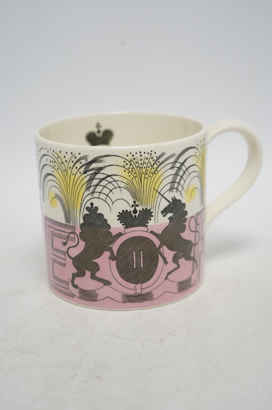 Eric Ravilious for Wedgwood, a 1953 Coronation mug, 10.5cm high, together with a Laura Knight coronation mug. Condition - fair to good